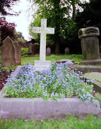 lewis Carroll's grave overgrown with forget-me-nots